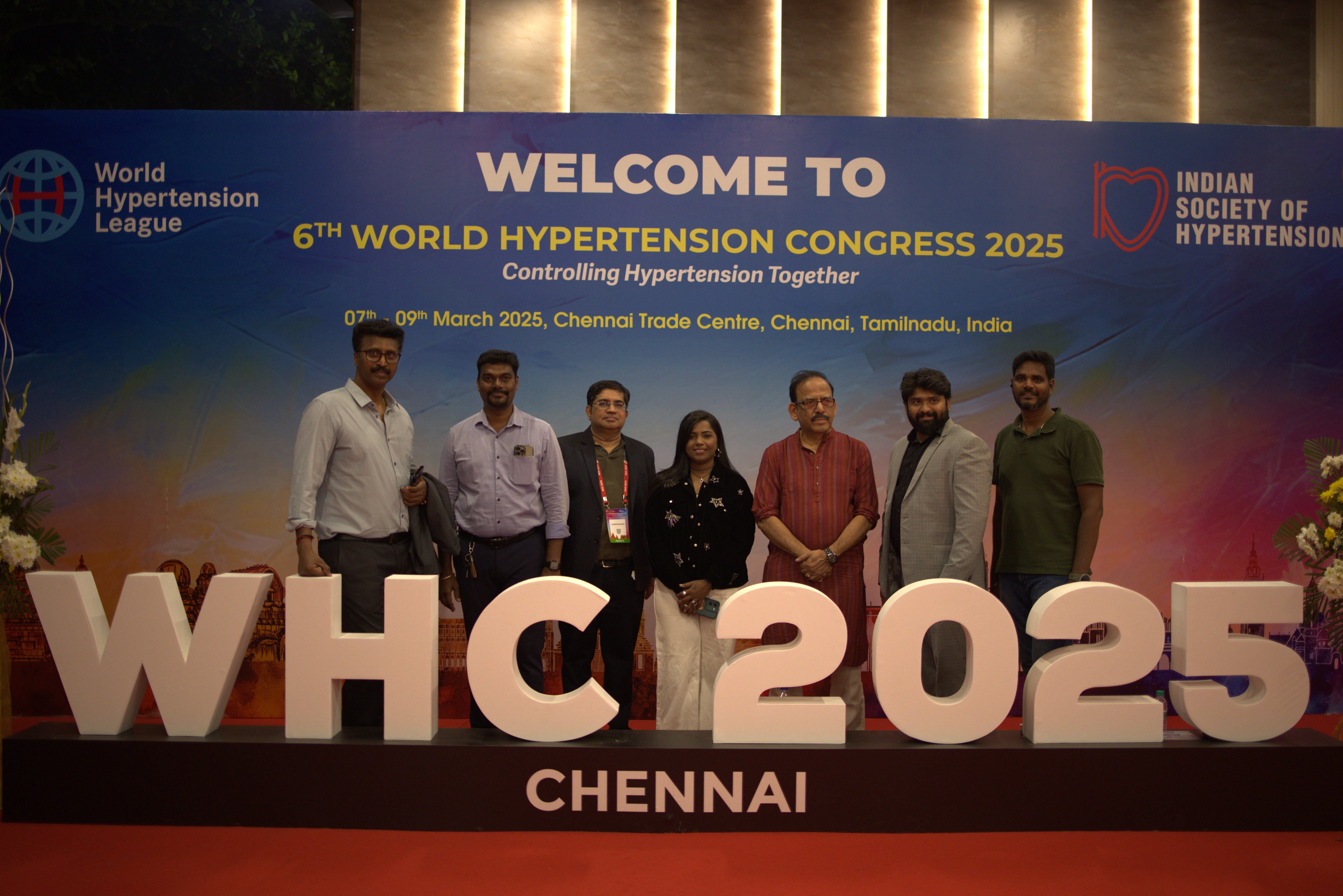 Packed AOCR 2025 plenary hall with a large lit stage and delegates