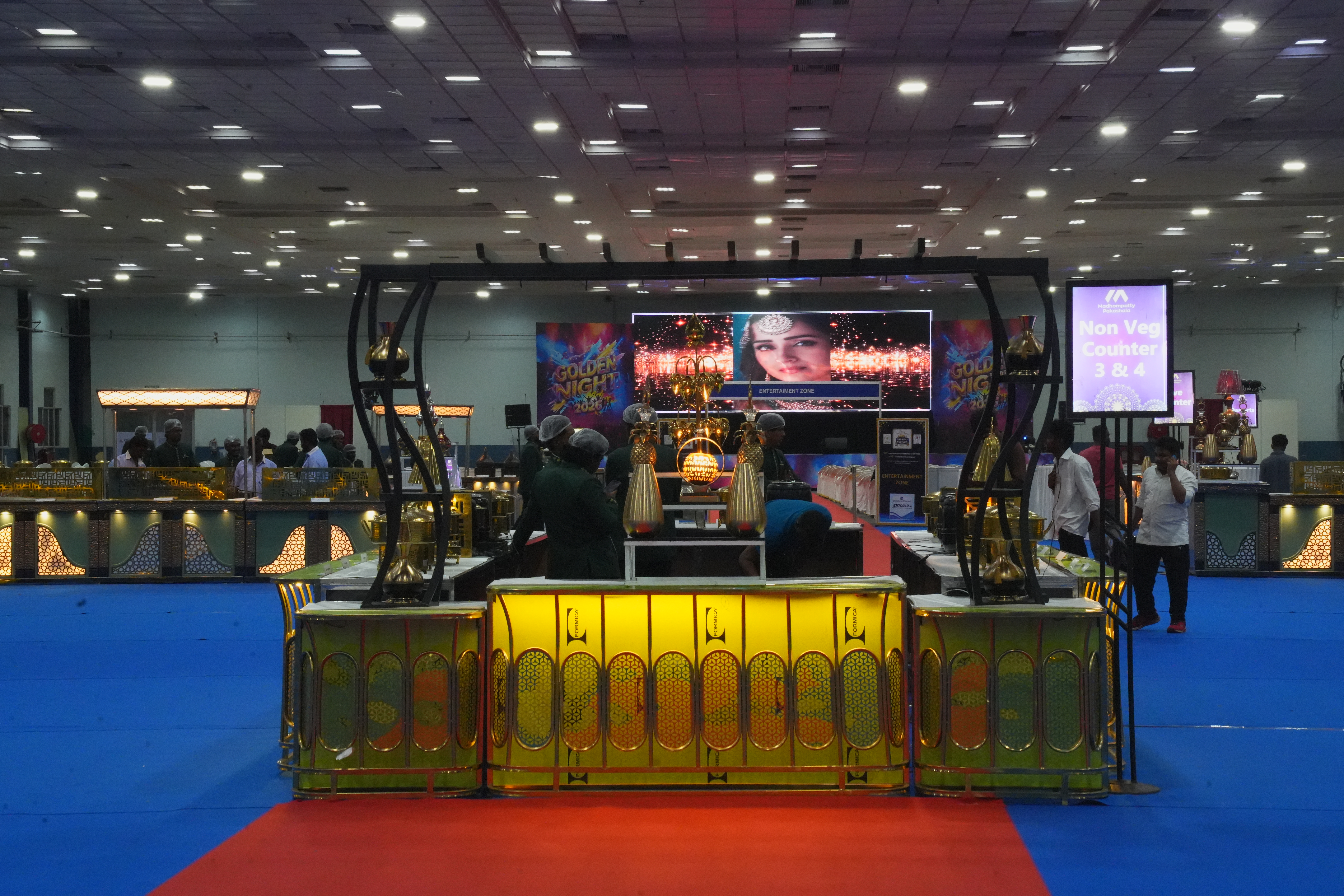 Golden Night gala dining hall with veg and non-veg live catering counters by Pavithram Events